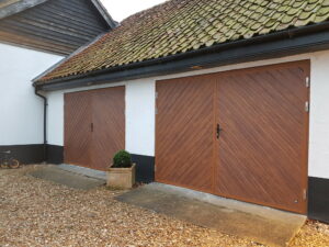 Side hinged garage doors are used extensively in garage conversions when keeping heat inside the home is a priority