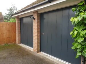 Side sliding garage doors are great as a space saver where there is very little internal headroom, or in garages with wide openings
