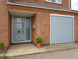 Matching light grey front door and garage