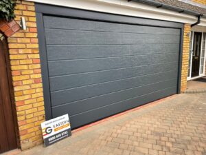 Sectional door with textured finish 