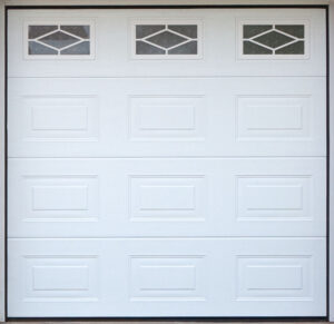 Close up detail of a panelled glazed design on a sectional garage door